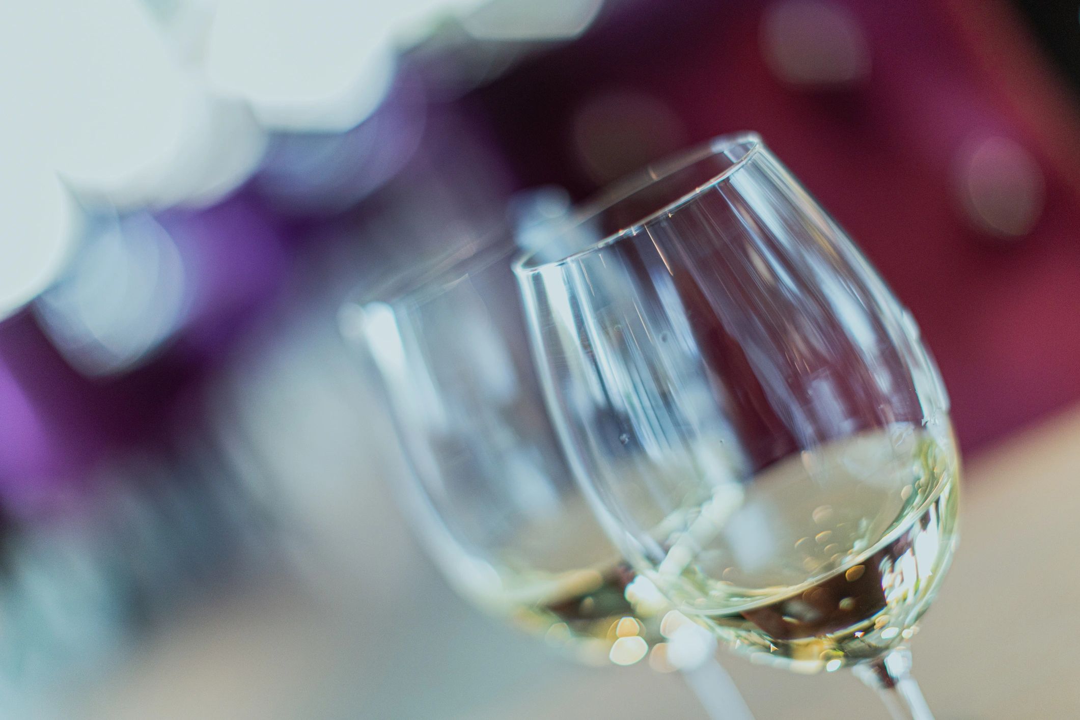 Two glasses of white wine on a table