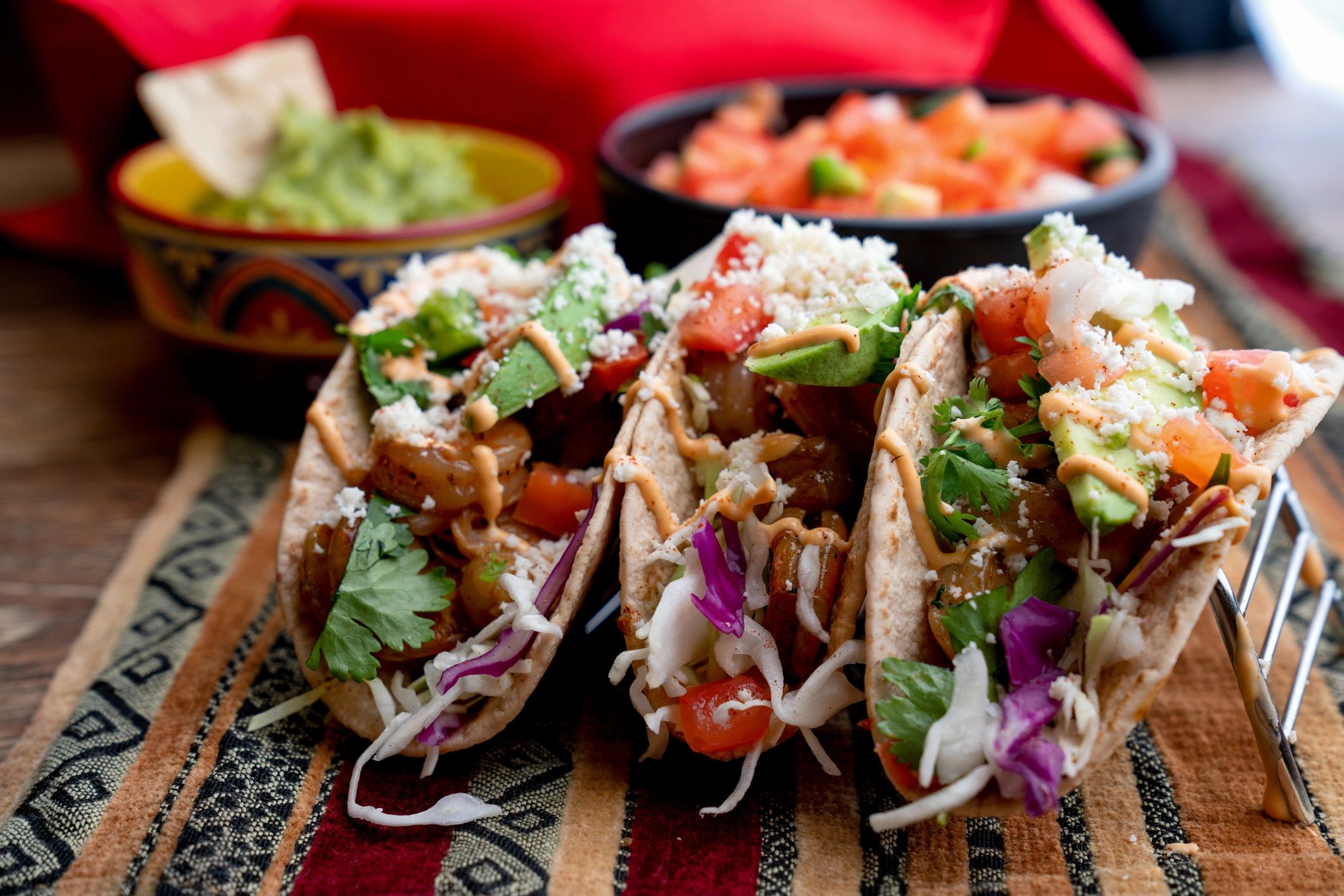 Close-up of shrimp tacos with fresh toppings