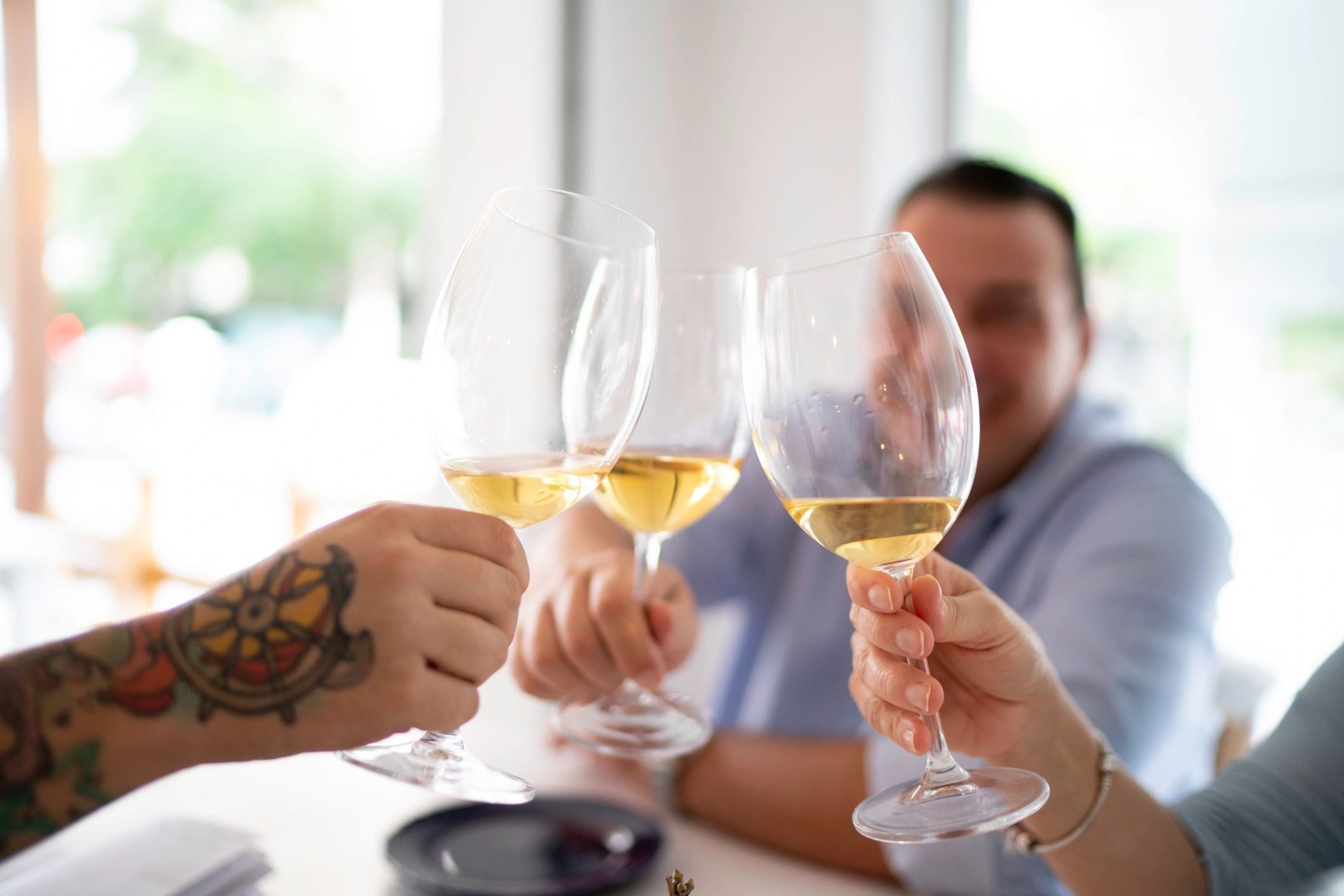 Friends toasting wine at a restaurant