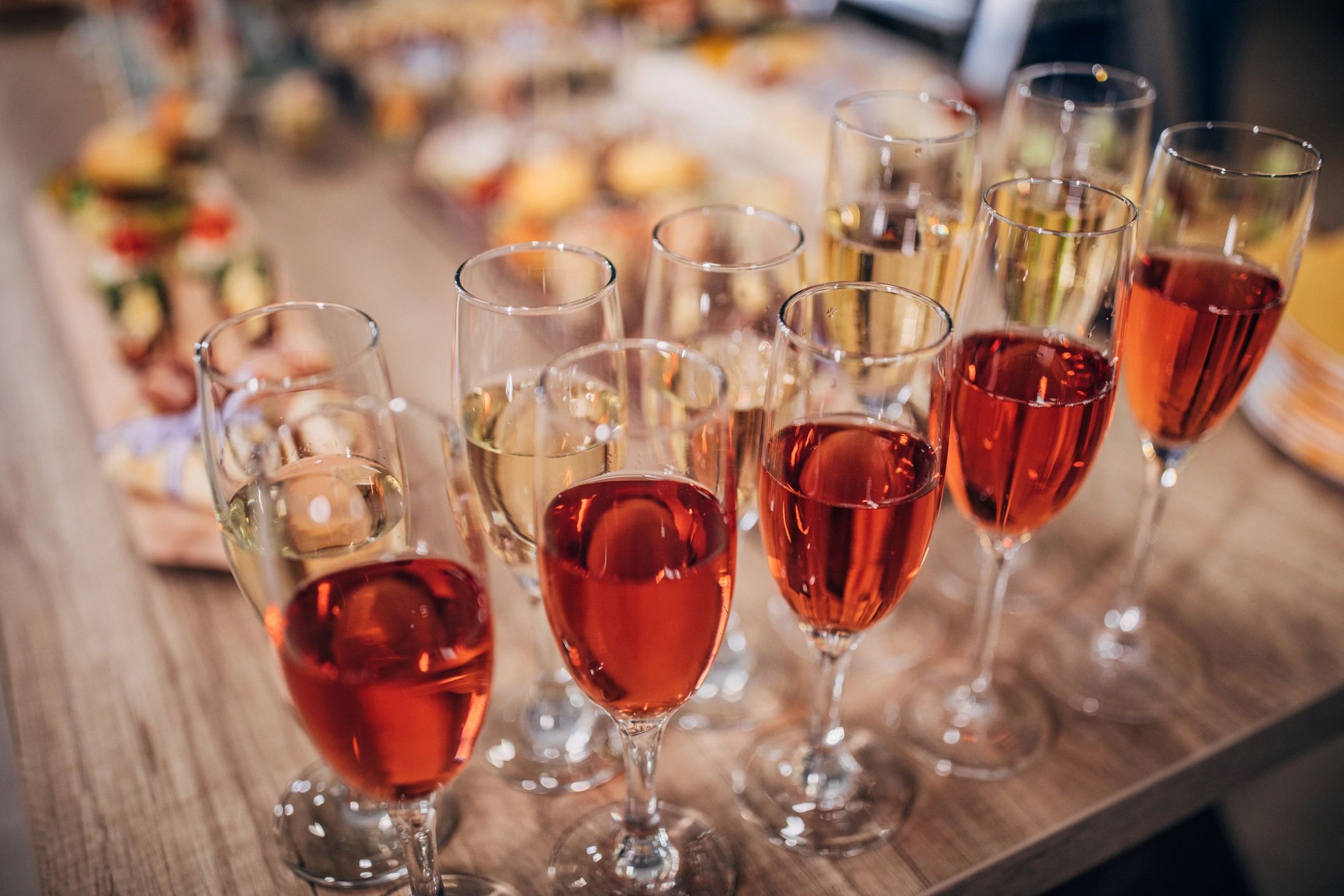 Wine glasses and small bites arranged on a table
