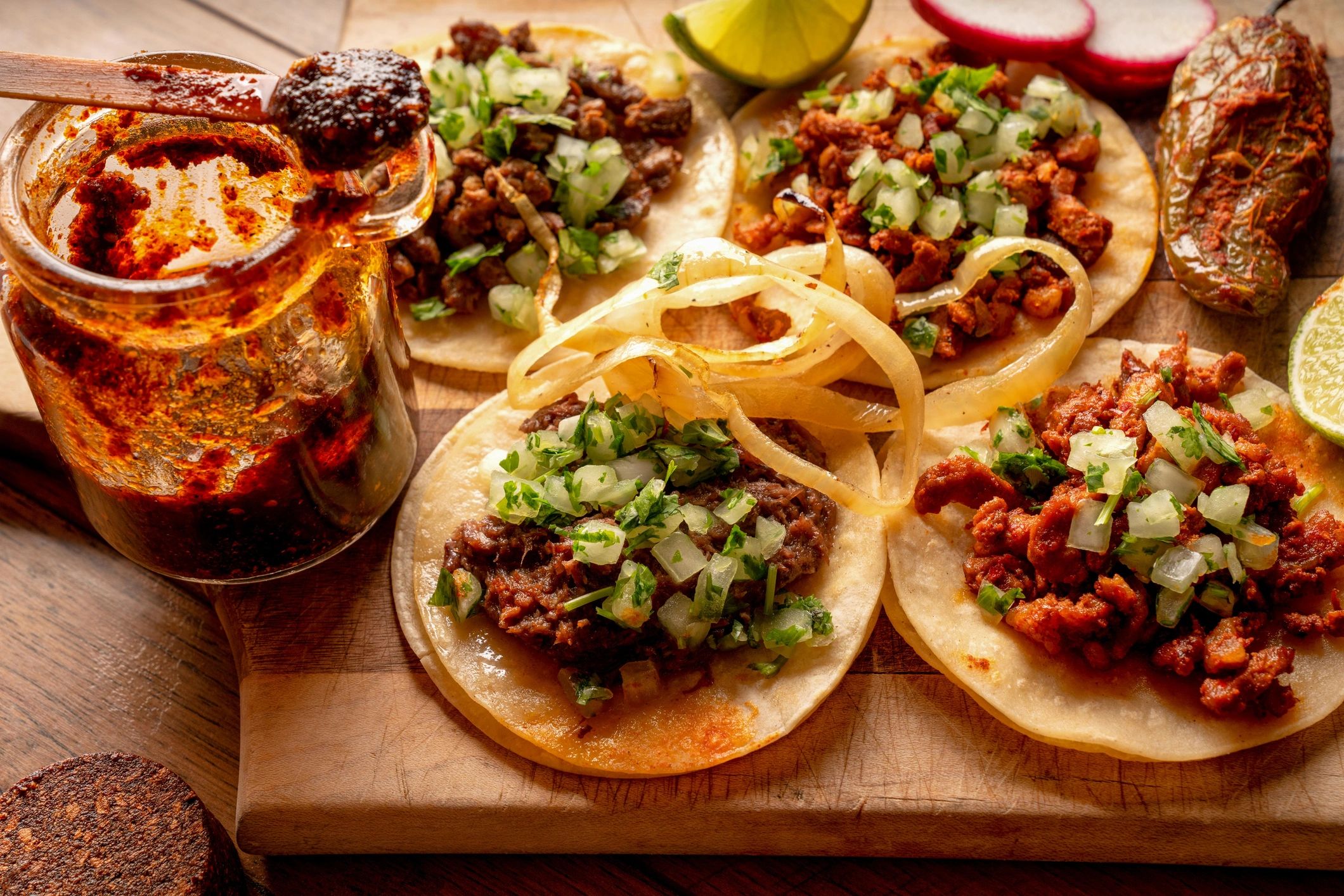 Assorted tacos arranged on a board